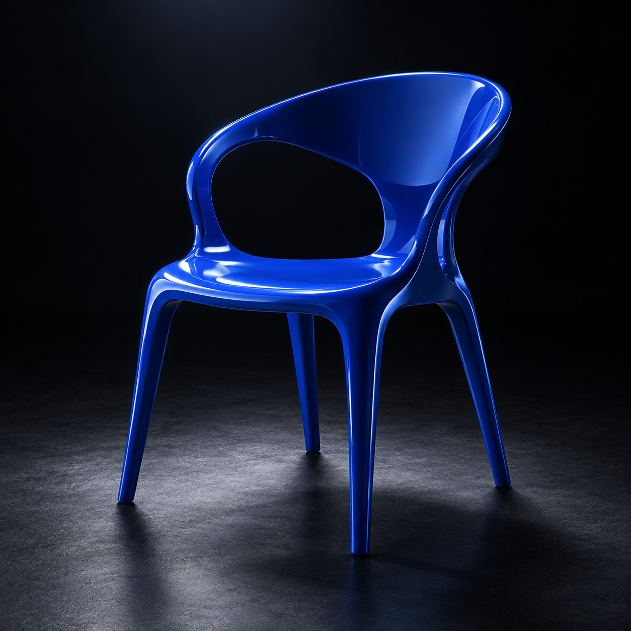 A sculptural cobalt blue chair under a spotlight